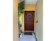 Charming front door with a secure lock, inviting entrance to the property at 5681 Bentgrass Dr # 13-201, Sarasota, FL 34235