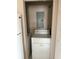 Cozy laundry area featuring a white dryer unit and adjacent washing machine hookups at 5681 Bentgrass Dr # 13-201, Sarasota, FL 34235