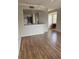 Spacious living room with wood flooring, open layout, and natural light at 5681 Bentgrass Dr # 13-201, Sarasota, FL 34235