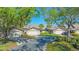 Charming townhouse exterior with attached garages, manicured lawns, and a welcoming driveway at 5688 Pipers Waite # 50, Sarasota, FL 34235