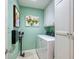 Compact laundry room equipped with a washer, dryer, and storage cabinets at 5688 Pipers Waite # 50, Sarasota, FL 34235