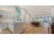Open-concept living space with light wood floors, large windows, and water views at 5688 Pipers Waite # 50, Sarasota, FL 34235