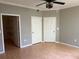 Bedroom with two doors and access to a walk-in closet at 5691 Bentgrass Dr # 15-102, Sarasota, FL 34235