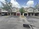 View of townhomes with attached garages and well-maintained landscaping at 5691 Bentgrass Dr # 15-102, Sarasota, FL 34235