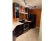 Modern kitchen features stainless steel appliances and granite countertops, providing ample workspace at 5691 Bentgrass Dr # 15-102, Sarasota, FL 34235