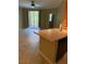 Bright living room with sliding glass doors leading to a balcony at 5691 Bentgrass Dr # 15-102, Sarasota, FL 34235