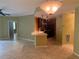 Inviting living room showcasing tiled floors that seamlessly transitions to the kitchen area at 5691 Bentgrass Dr # 15-102, Sarasota, FL 34235
