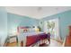 Bright bedroom with a decorative bed, large window, and charming decor at 6342 7Th W Ave # 6342, Bradenton, FL 34209