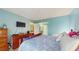Spacious bedroom featuring blue walls, wood flooring, and ample closet space at 6342 7Th W Ave # 6342, Bradenton, FL 34209