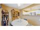 Dining room with a round table, four chairs, and an old-fashioned liquor cabinet at 6342 7Th W Ave # 6342, Bradenton, FL 34209