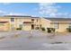 Tan two-story condo building with multiple units and reserved parking in a well-maintained complex at 6342 7Th W Ave # 6342, Bradenton, FL 34209