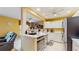 Modern kitchen with white cabinets, stainless steel appliances, and white countertops at 6342 7Th W Ave # 6342, Bradenton, FL 34209