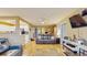Living room with hardwood floors, a ceiling fan and a view of the kitchen at 6342 7Th W Ave # 6342, Bradenton, FL 34209