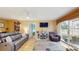 Bright living room with hardwood floors, a sliding glass door, and a television at 6342 7Th W Ave # 6342, Bradenton, FL 34209