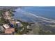 Aerial view of waterfront condo community with boat access and adjacent shoreline at 6460 Mourning Dove Dr # 204, Bradenton, FL 34210