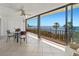 Balcony with table and chairs overlooking a scenic ocean view from condo at 6460 Mourning Dove Dr # 204, Bradenton, FL 34210