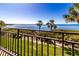 Beautiful water view from condo balcony with manicured trees at 6460 Mourning Dove Dr # 204, Bradenton, FL 34210