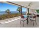 Relaxing balcony featuring a dining table and chairs with panoramic views of the bay at 6460 Mourning Dove Dr # 204, Bradenton, FL 34210