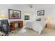 Comfortable bedroom featuring a desk, chair, and artistic wall decor at 6460 Mourning Dove Dr # 204, Bradenton, FL 34210