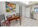 Eating space in kitchen featuring tile floors, stainless steel appliances, and bright lighting at 6460 Mourning Dove Dr # 204, Bradenton, FL 34210
