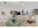 Inviting living room with coastal decor, large glass doors, and stunning ocean views at 6460 Mourning Dove Dr # 204, Bradenton, FL 34210