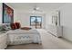 Charming main bedroom with a private balcony overlooking serene ocean views at 6460 Mourning Dove Dr # 204, Bradenton, FL 34210