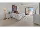 Well-lit main bedroom with a balcony offering beautiful outdoor scenery at 6460 Mourning Dove Dr # 204, Bradenton, FL 34210