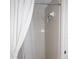 Tiled shower and shower curtain at 6505 Stone River Rd # 306, Bradenton, FL 34203