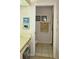 Bathroom vanity and toilet with towel display and coastal art at 6505 Stone River Rd # 306, Bradenton, FL 34203