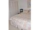 Comfortable bedroom with a bed, shuttered closet doors, and minimal decor at 6505 Stone River Rd # 306, Bradenton, FL 34203