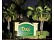 Tara Golf & Country Club private entrance sign framed by palm trees at 6505 Stone River Rd # 306, Bradenton, FL 34203