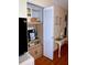 Hallway area with mini-fridge, storage, and a console table that adds a touch of functional style at 6505 Stone River Rd # 306, Bradenton, FL 34203
