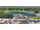 Aerial shot of clubhouse, lake, parking lot and golf course at 6637 Taeda Dr, Sarasota, FL 34241
