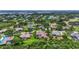 Aerial view of neighborhood featuring ponds, mature trees, and well-manicured lawns at 6637 Taeda Dr, Sarasota, FL 34241