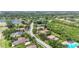 An aerial view of a residential neighborhood featuring well-maintained lawns and mature trees at 6637 Taeda Dr, Sarasota, FL 34241