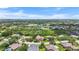 Aerial view of community with lakes, golf courses, and mature landscaping at 6637 Taeda Dr, Sarasota, FL 34241
