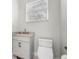 Powder room featuring a marble countertop, modern faucet, and toilet at 6637 Taeda Dr, Sarasota, FL 34241