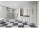 Bright bathroom featuring a spacious layout with a soaking tub, walk-in shower, and dual vanity with ample storage at 6637 Taeda Dr, Sarasota, FL 34241