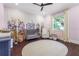 Charming Bedroom with floral wall decor, comfortable seating, and a large area rug at 6637 Taeda Dr, Sarasota, FL 34241