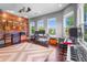 Music room with musical instruments and three large sunny windows at 6637 Taeda Dr, Sarasota, FL 34241