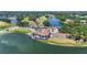 Aerial view of a stunning golf course clubhouse with pond, parking and landscaping at 6637 Taeda Dr, Sarasota, FL 34241
