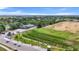 Aerial view of a driving range and golf course on a sunny day in a residential area at 6637 Taeda Dr, Sarasota, FL 34241
