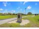Serenola Golf Club hole one with manicured green grass and blue skies on a sunny day at 6637 Taeda Dr, Sarasota, FL 34241