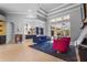 Open-concept living room featuring modern decor, high ceilings, and seamless access to the outdoor area at 6637 Taeda Dr, Sarasota, FL 34241