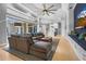 Spacious living room with comfortable seating, a large window, and open access to kitchen at 6637 Taeda Dr, Sarasota, FL 34241