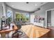 Bright home office featuring a large desk, comfortable seating, and ample natural light at 6637 Taeda Dr, Sarasota, FL 34241