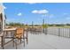 Enjoy a view of the lake while relaxing on this open-air patio with tables and seating at 6637 Taeda Dr, Sarasota, FL 34241