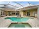 Backyard view of pool and spa with outdoor lounge area, fully screened-in for year-round enjoyment at 6637 Taeda Dr, Sarasota, FL 34241