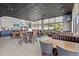 Bright restaurant featuring bar, tables, chairs, booths and big windows at 6637 Taeda Dr, Sarasota, FL 34241