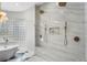 Elegant shower with double shower heads, bench, and unique window, complemented by modern fixtures at 6637 Taeda Dr, Sarasota, FL 34241
